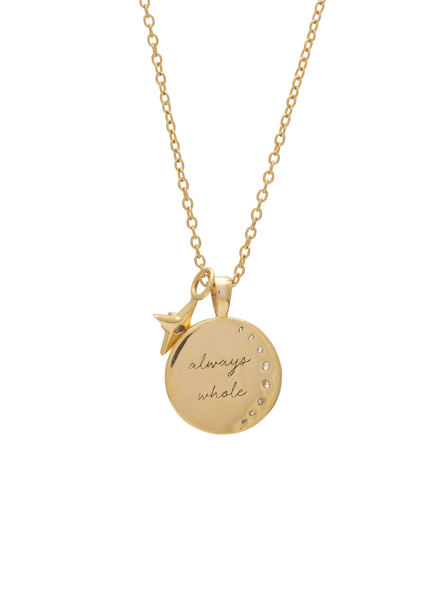 a pendant on a chain showing the engraving on the back that reads always whole
