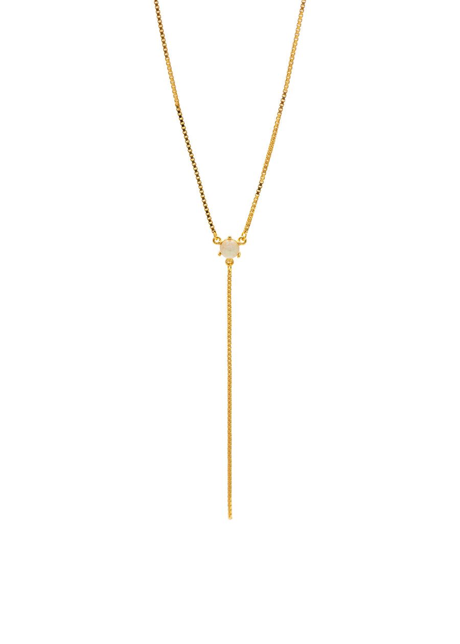 Gold necklace with a small pendant on a white background