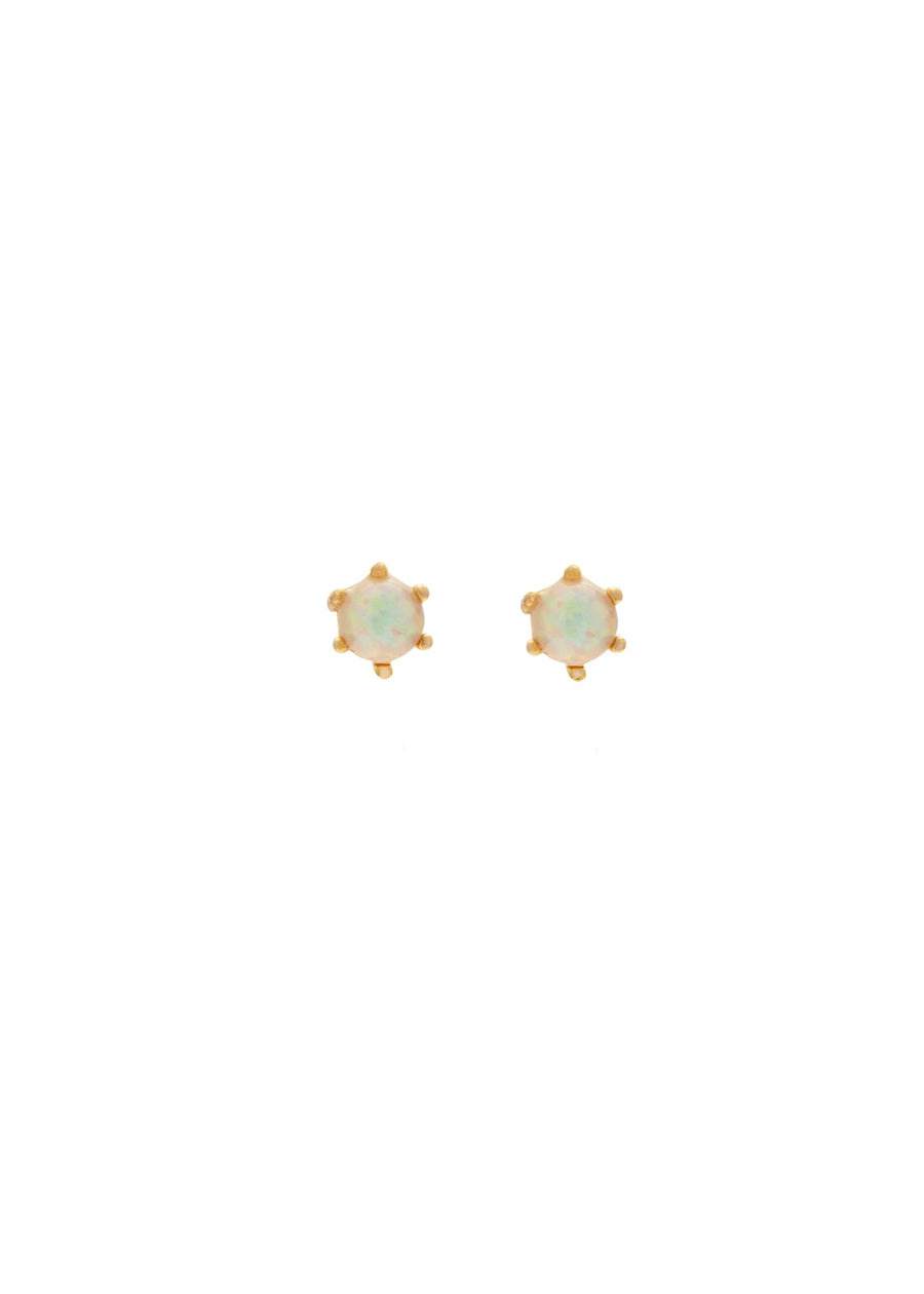 Pair of gold earrings with opal stones on a white background