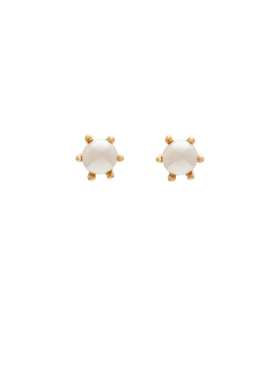 Pair of gold earrings with white stones on a white background