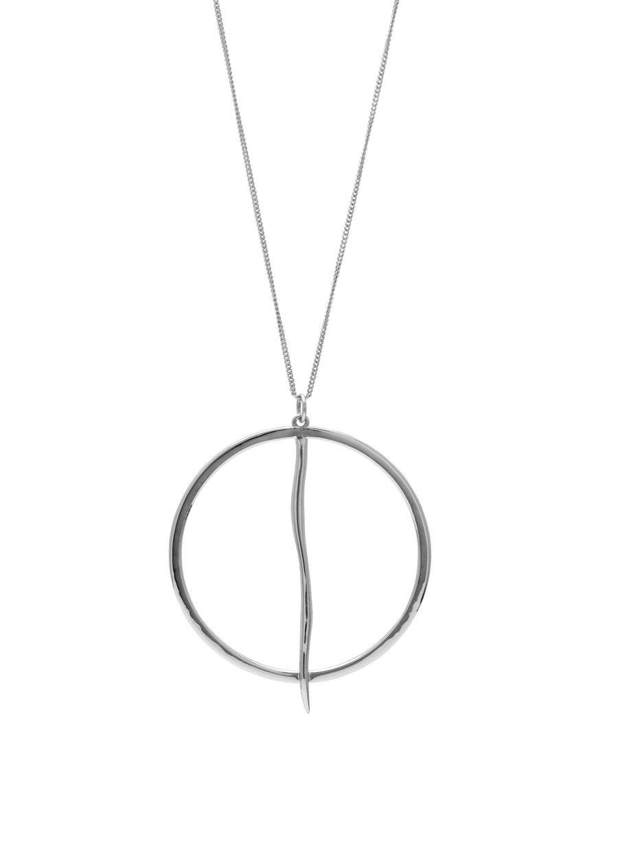 Silver necklace with a circular pendant on a white background