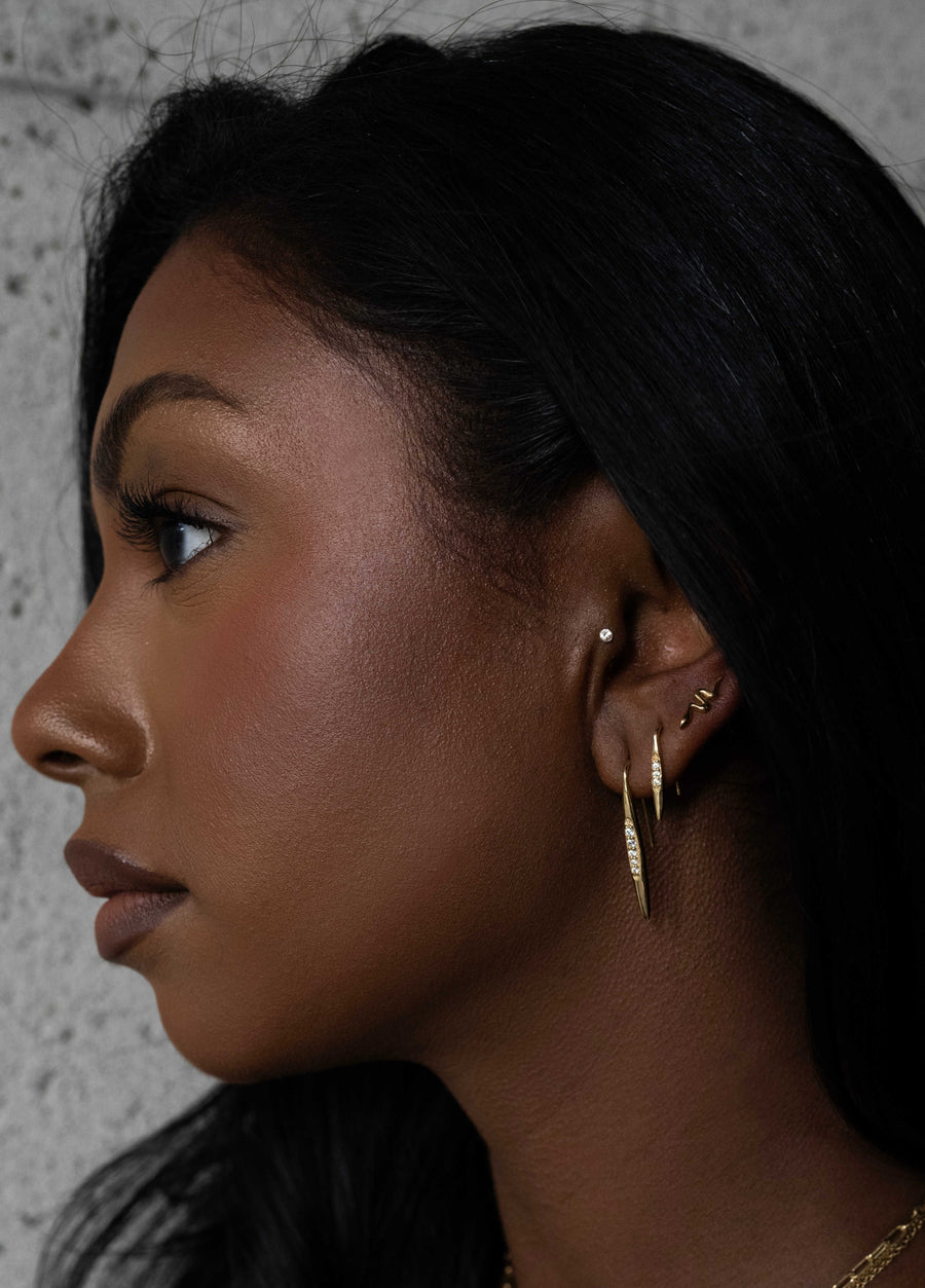 profile photo of model wearing three different Sarah Mulder Jewelry earrings