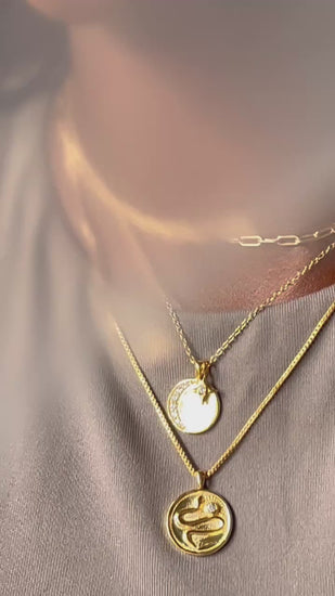video showing 3 necklaces in gold worn on a model by Sarah Mulder Jewelry