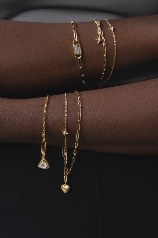 Sarah Mulder Jewelry layers of bracelets worn by a model