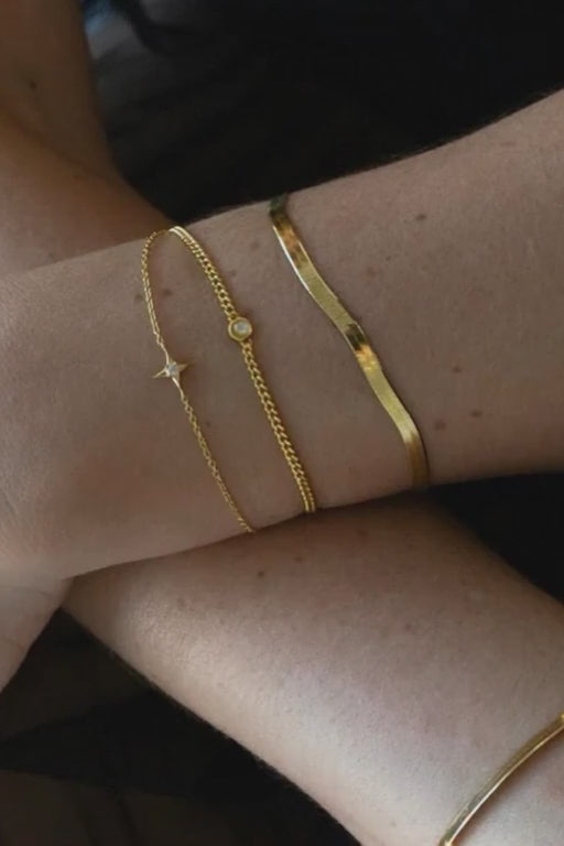 a layers of gold Sarah Mulder Jewelry bracelets