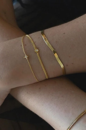 a layers of gold Sarah Mulder Jewelry bracelets