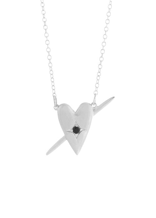 a silver heart necklace by Sarah Mulder Jewelry on a white backdrop