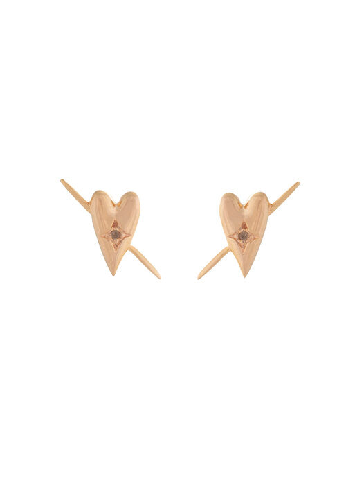 gold heart shaped earrings by designer Sarah Mulder on a white background