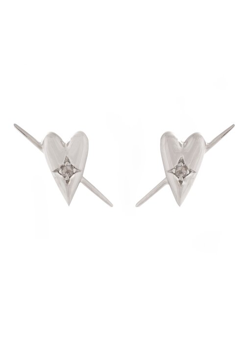 silver studs on a white background in heart shapes