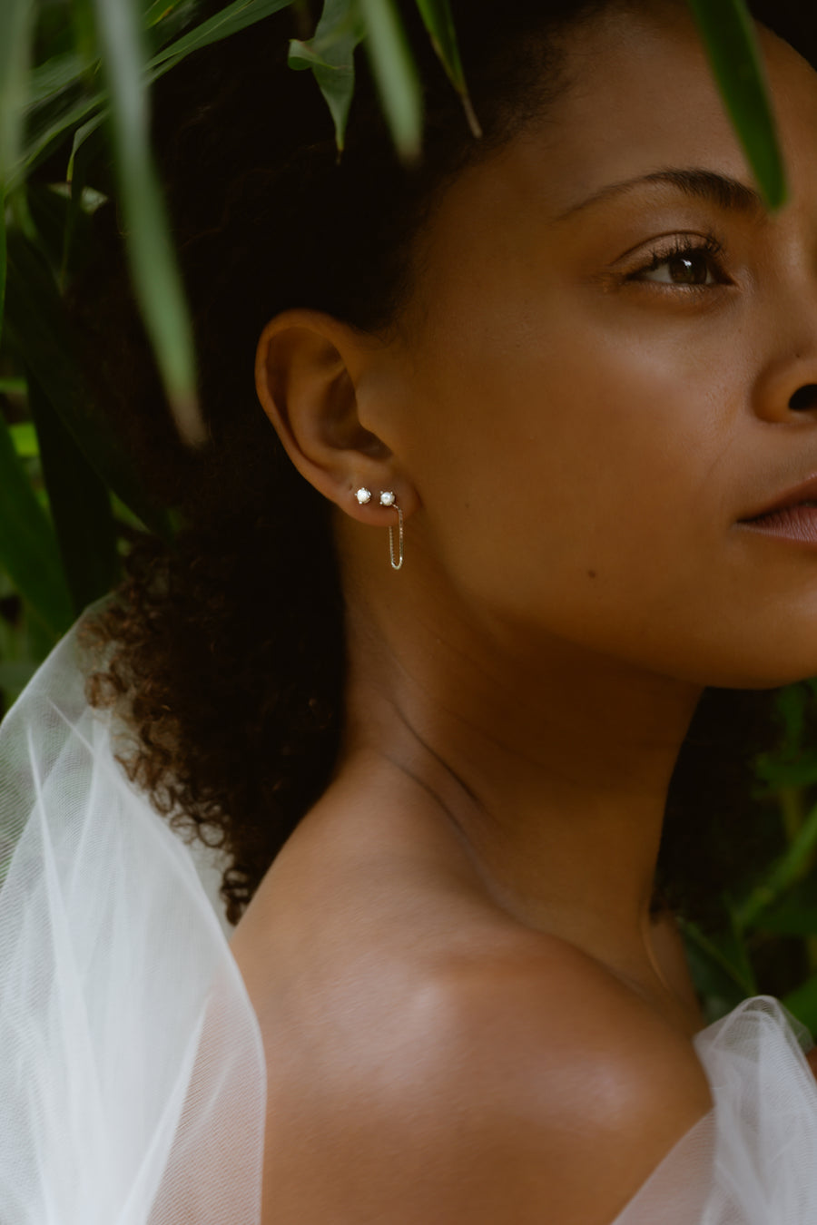 Alex earrings in pearl on a model 