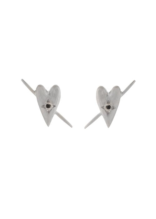 a pair of silver heart earrings by designer sarah mulder on a white backdrop